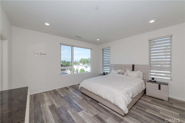 bedroom with hardwood / wood-style flooring