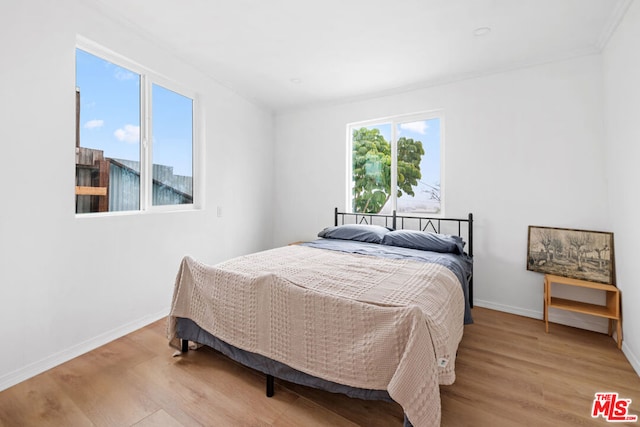 bedroom featuring light wood-type flooring