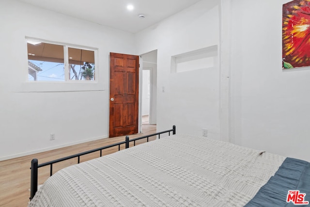 bedroom featuring hardwood / wood-style flooring