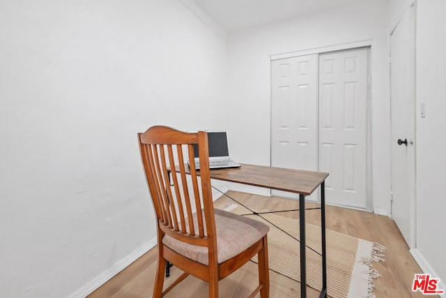 office area with light hardwood / wood-style floors