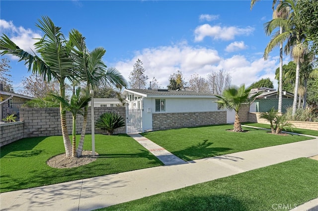 ranch-style house featuring a front lawn