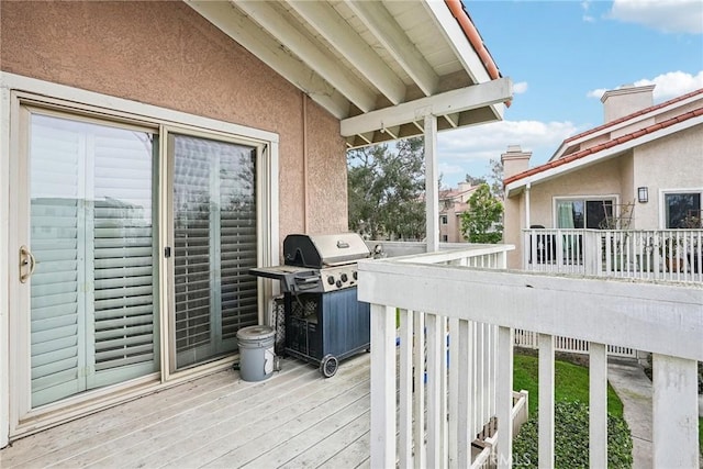 deck featuring a grill