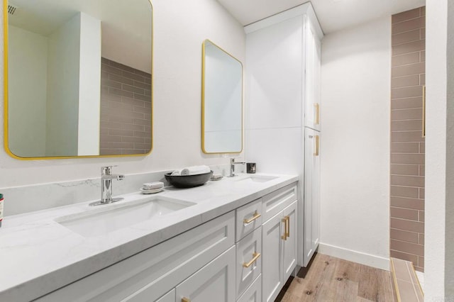 bathroom featuring vanity and hardwood / wood-style flooring