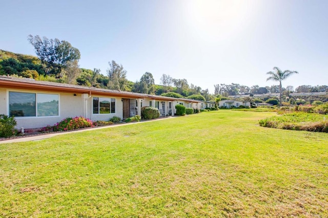 exterior space with a front yard