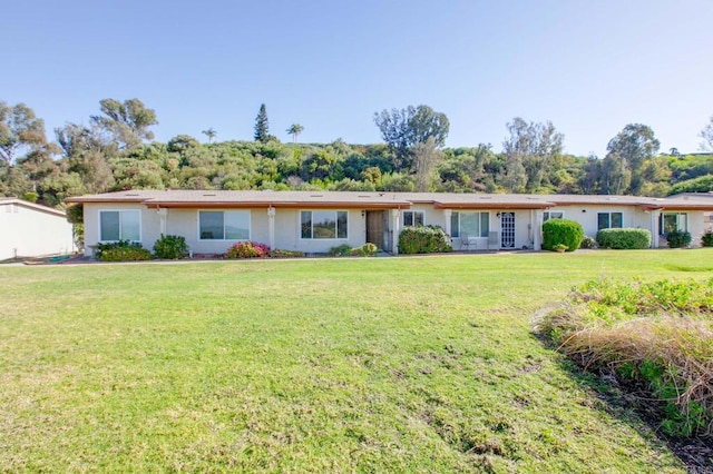 ranch-style home with a front yard