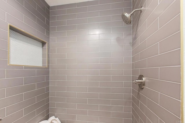 bathroom with tiled shower