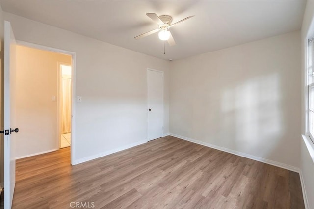 spare room with ceiling fan and light hardwood / wood-style floors