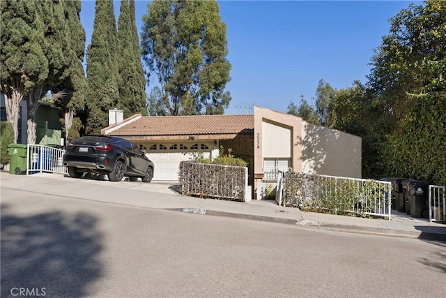 view of front of property with a garage