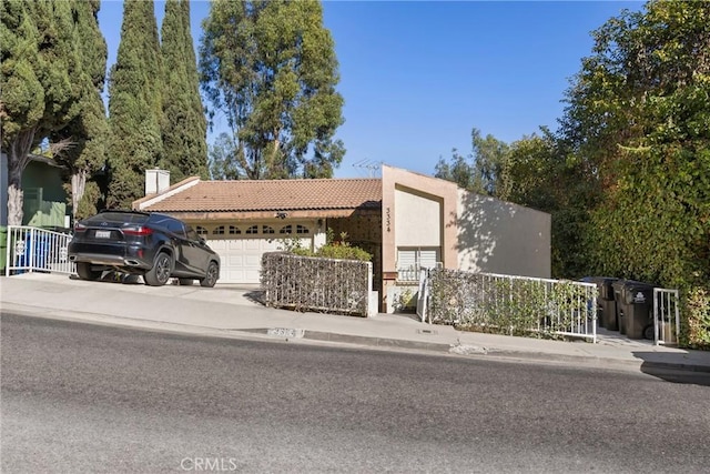 view of front of property with a garage