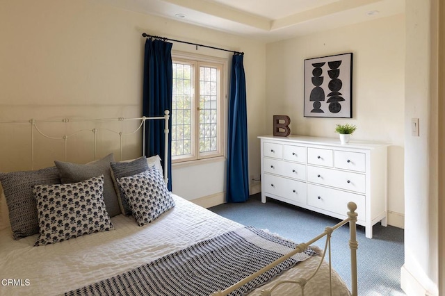 bedroom with dark carpet