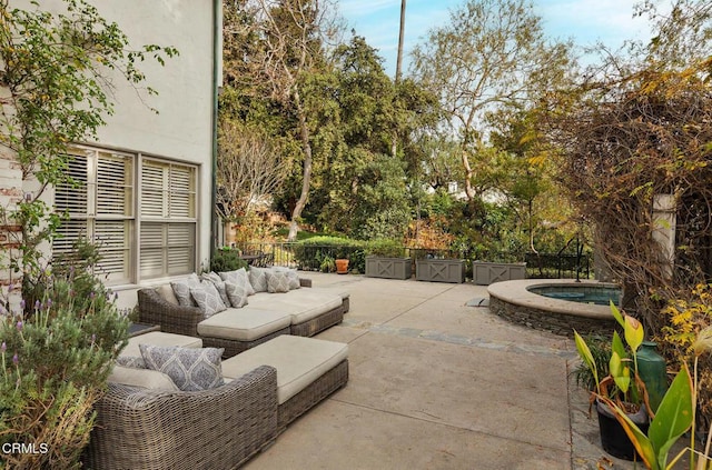 view of patio / terrace with an in ground hot tub and an outdoor hangout area