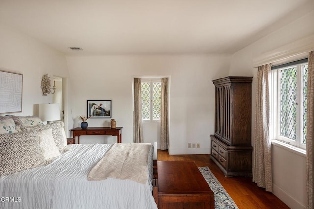 bedroom featuring dark wood-type flooring