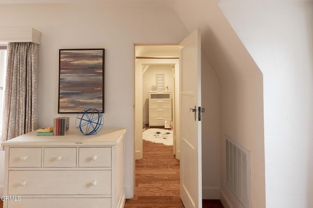 corridor featuring wood-type flooring