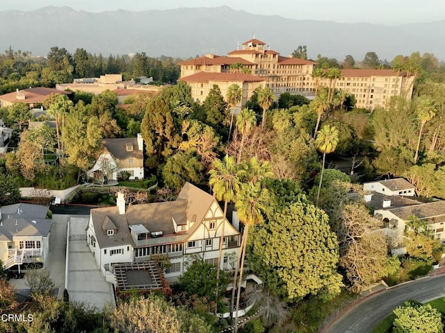 birds eye view of property with a mountain view