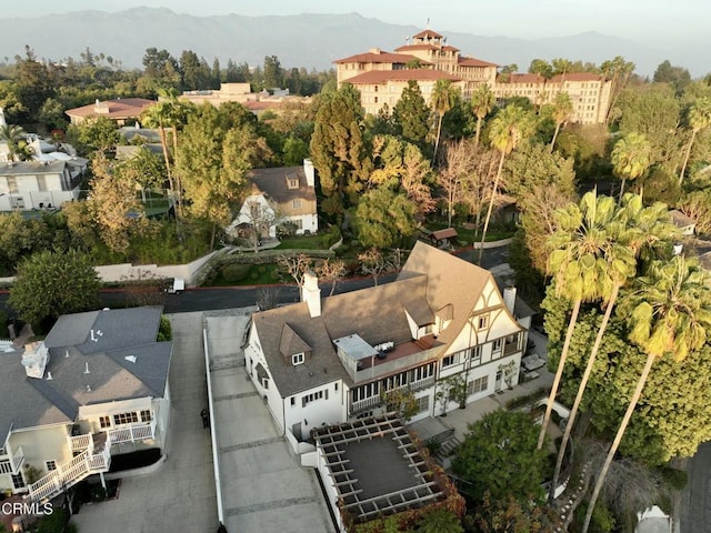 birds eye view of property with a mountain view