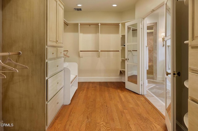 spacious closet with light wood-type flooring