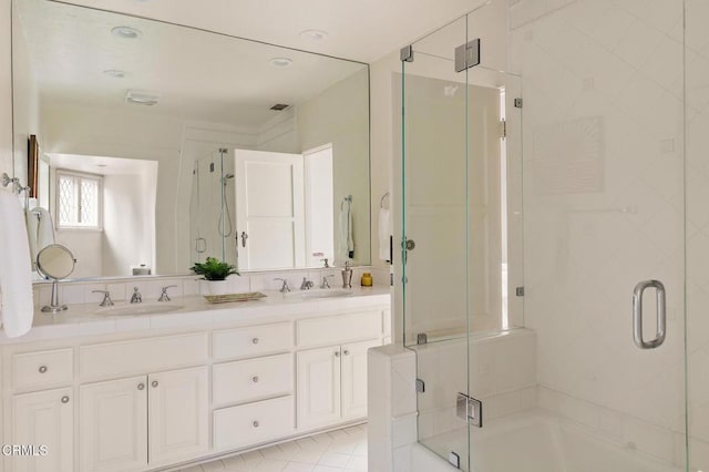 bathroom with vanity and an enclosed shower