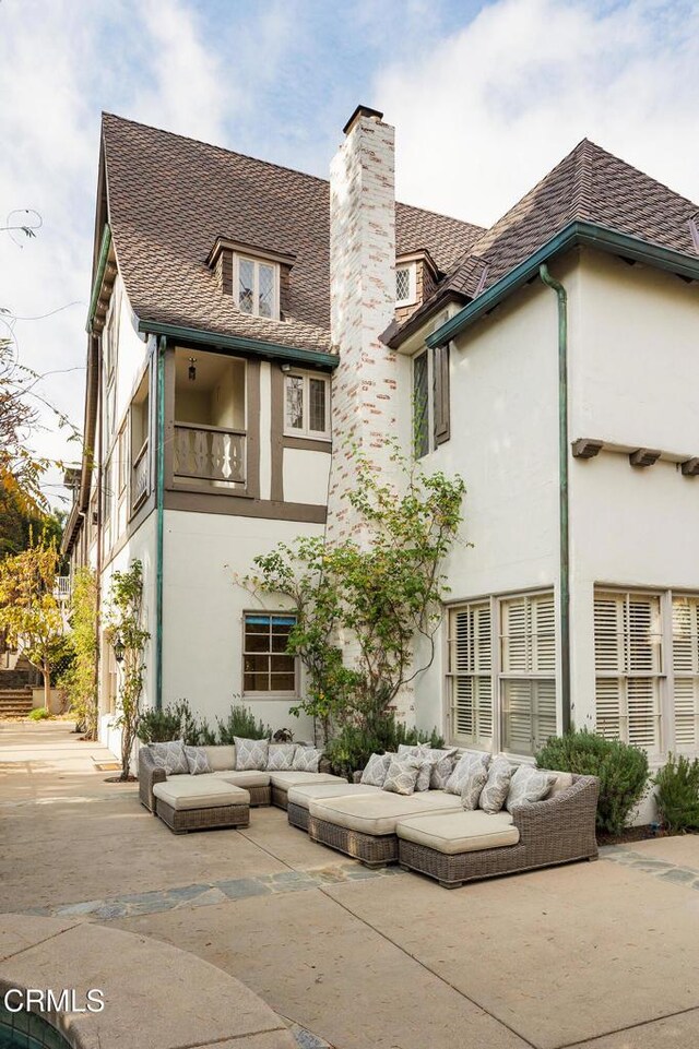 790 Huntington Cir, Pasadena, CA 91106 - rear view of house featuring stucco siding, a chimney, an outdoor living space, a balcony, and a patio