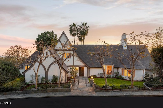 790 Huntington Cir, Pasadena, CA 91106 - tudor house with stucco siding, a yard, and a chimney