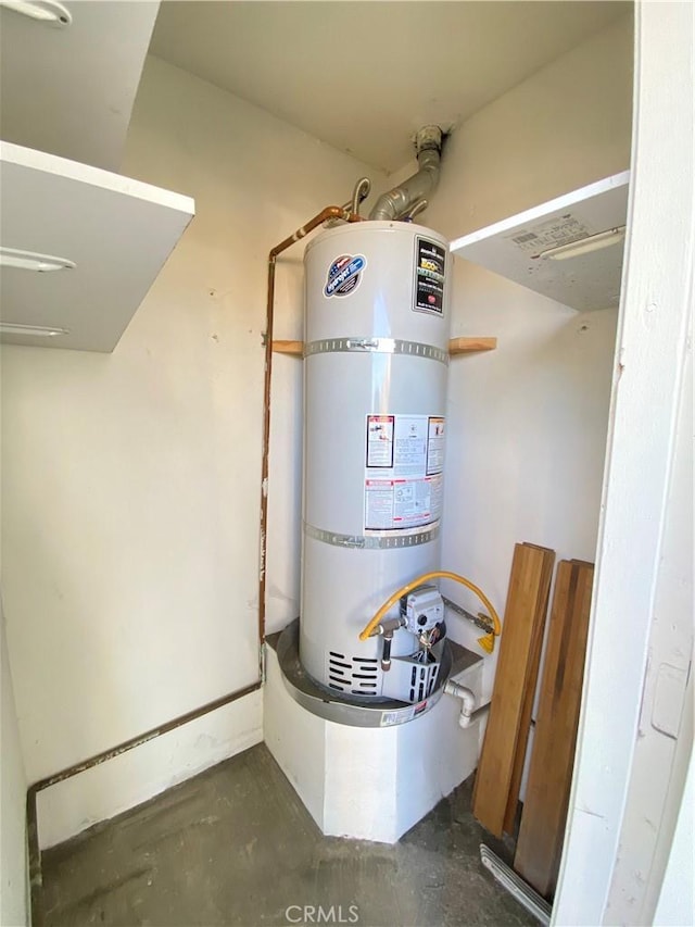 utility room featuring water heater