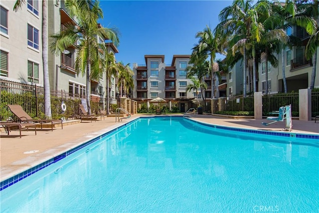 view of swimming pool featuring a patio area