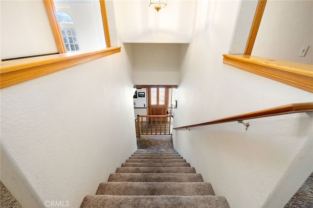 staircase with plenty of natural light