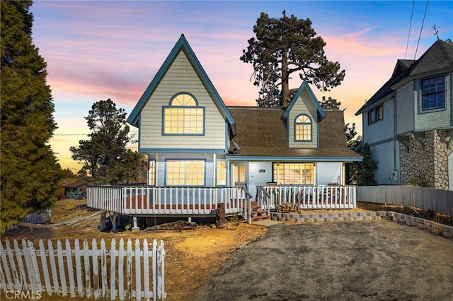 view of front facade featuring a wooden deck