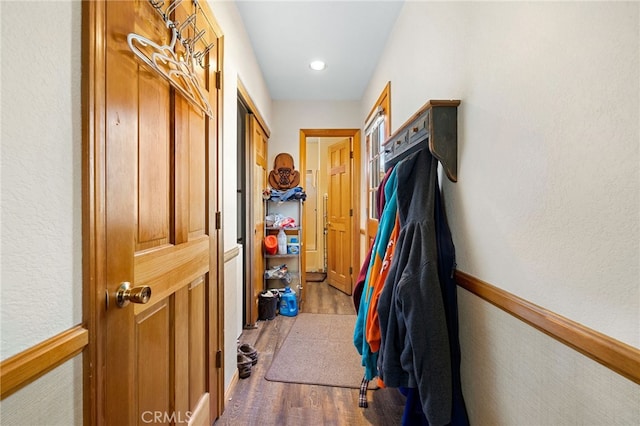 hall with hardwood / wood-style floors