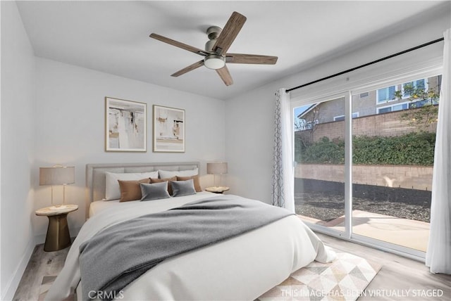 bedroom with light wood-type flooring, ceiling fan, access to exterior, and multiple windows