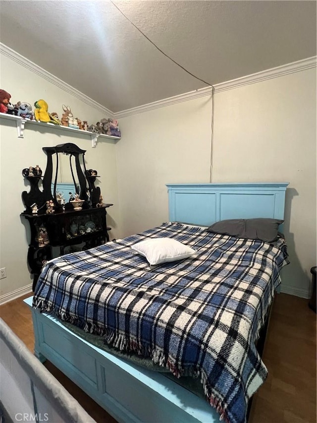 bedroom featuring dark hardwood / wood-style floors and crown molding