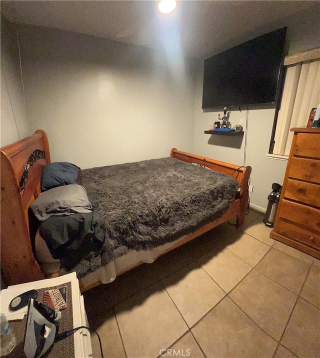 bedroom featuring light tile patterned floors