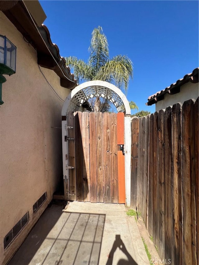 view of gate featuring fence