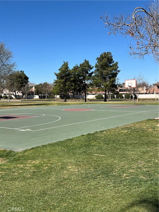 view of sport court with a yard and community basketball court