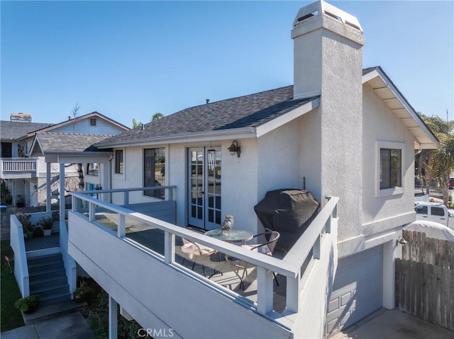 back of house with a garage