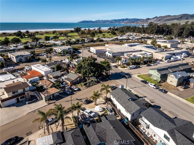 birds eye view of property featuring a water and mountain view