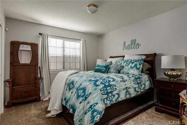 bedroom featuring dark carpet