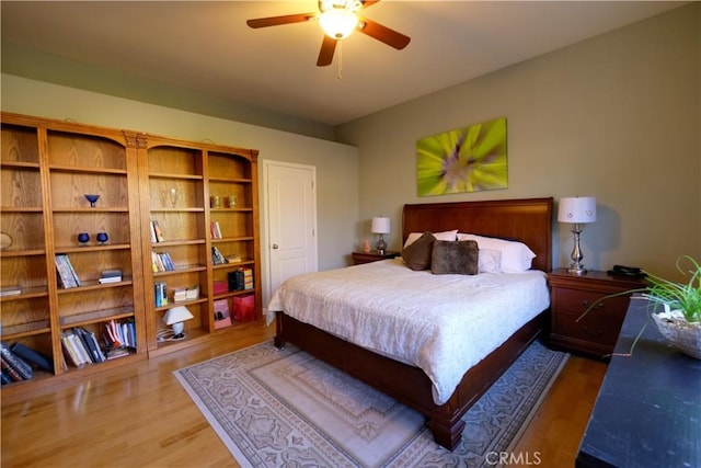 bedroom featuring dark hardwood / wood-style flooring and ceiling fan