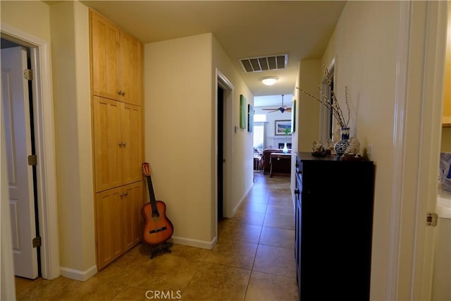 corridor featuring light tile patterned flooring