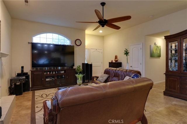 tiled living room with ceiling fan