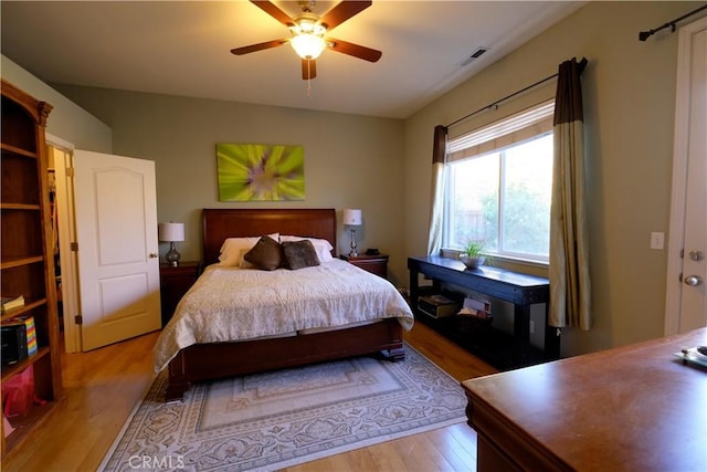 bedroom featuring ceiling fan and light hardwood / wood-style flooring