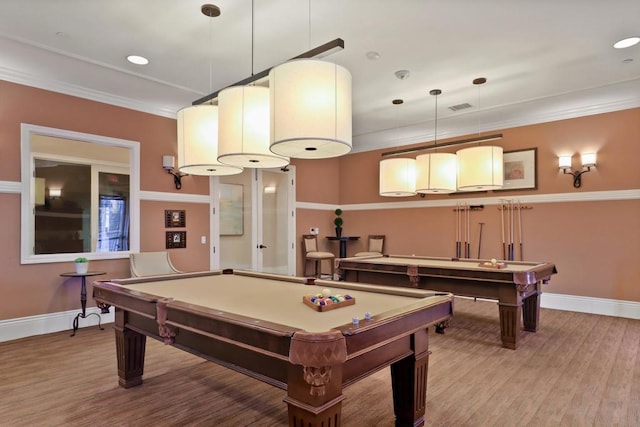 rec room with wood-type flooring, pool table, and ornamental molding