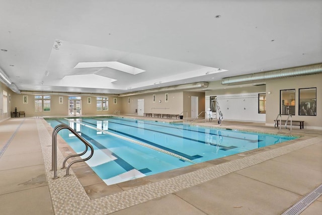 view of pool with a skylight