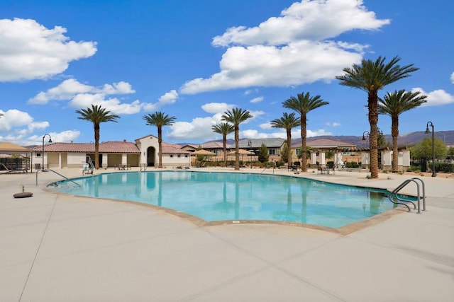 view of swimming pool with a patio area