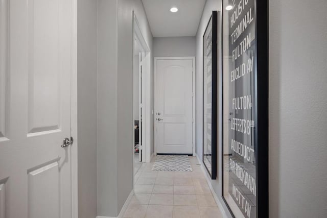 hallway with light tile patterned flooring