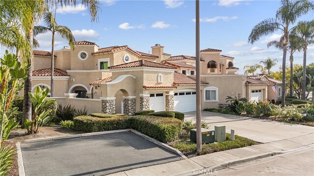 mediterranean / spanish-style house featuring a garage