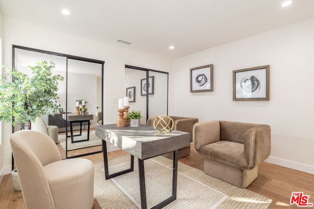 sitting room with light hardwood / wood-style flooring