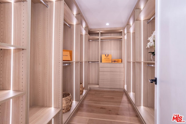 spacious closet featuring light wood-type flooring