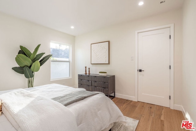 bedroom with light hardwood / wood-style flooring