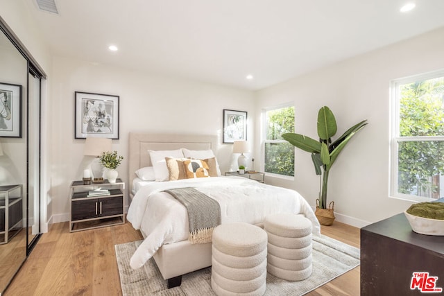 bedroom with light wood-type flooring