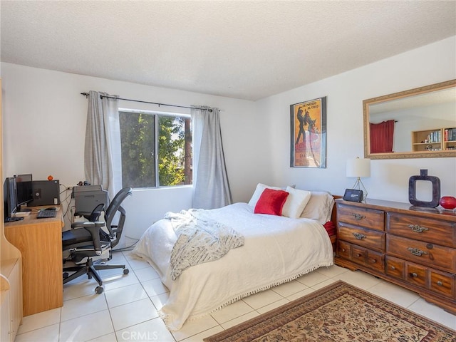 tiled bedroom with a textured ceiling